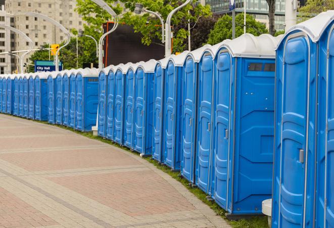 a row of portable restrooms for a special event, ensuring guests have access to clean facilities in Aventura